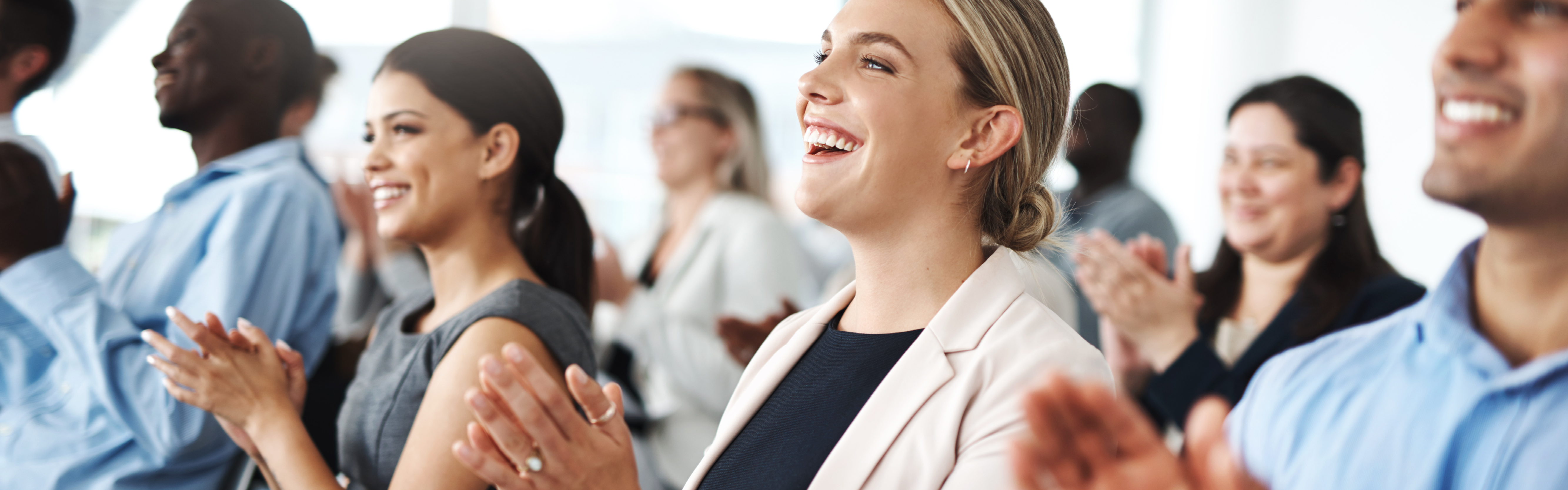 Professional audience clapping at presentation