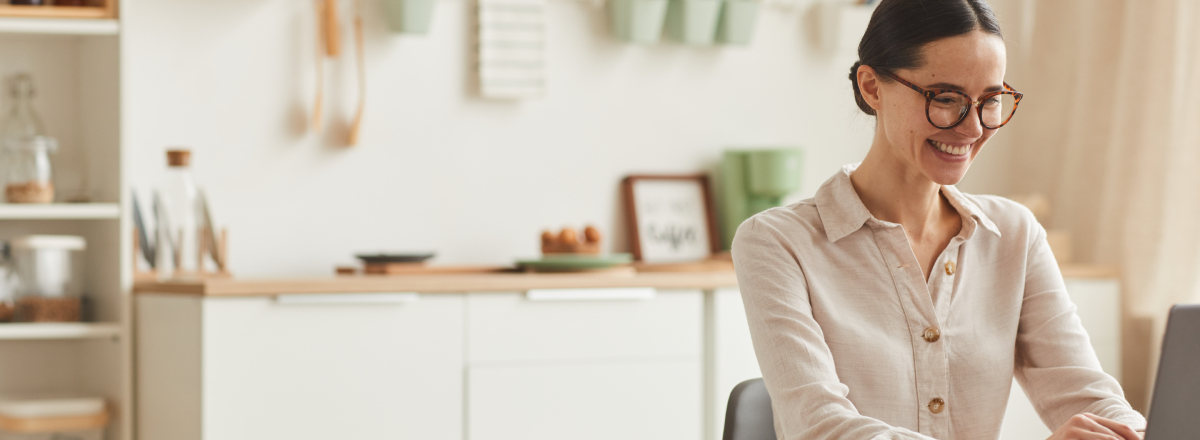 lady working from home in front on a laptop